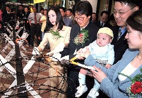 South Koreans cut barbed wire in advance of summit